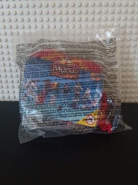 McDonald's Clear Packaged Toy with Red and Black Details